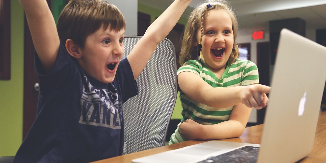 children-cheering-at-laptop-screen